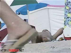 Beach hotties string up out naked below the sun